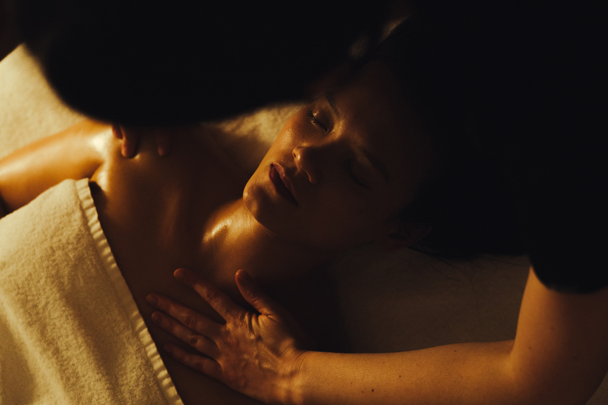 A woman indulges in a relaxing massage at a peaceful spa